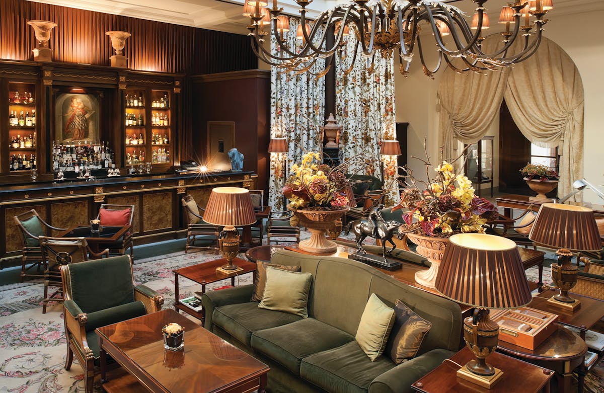 a living room filled with furniture and a fire place
